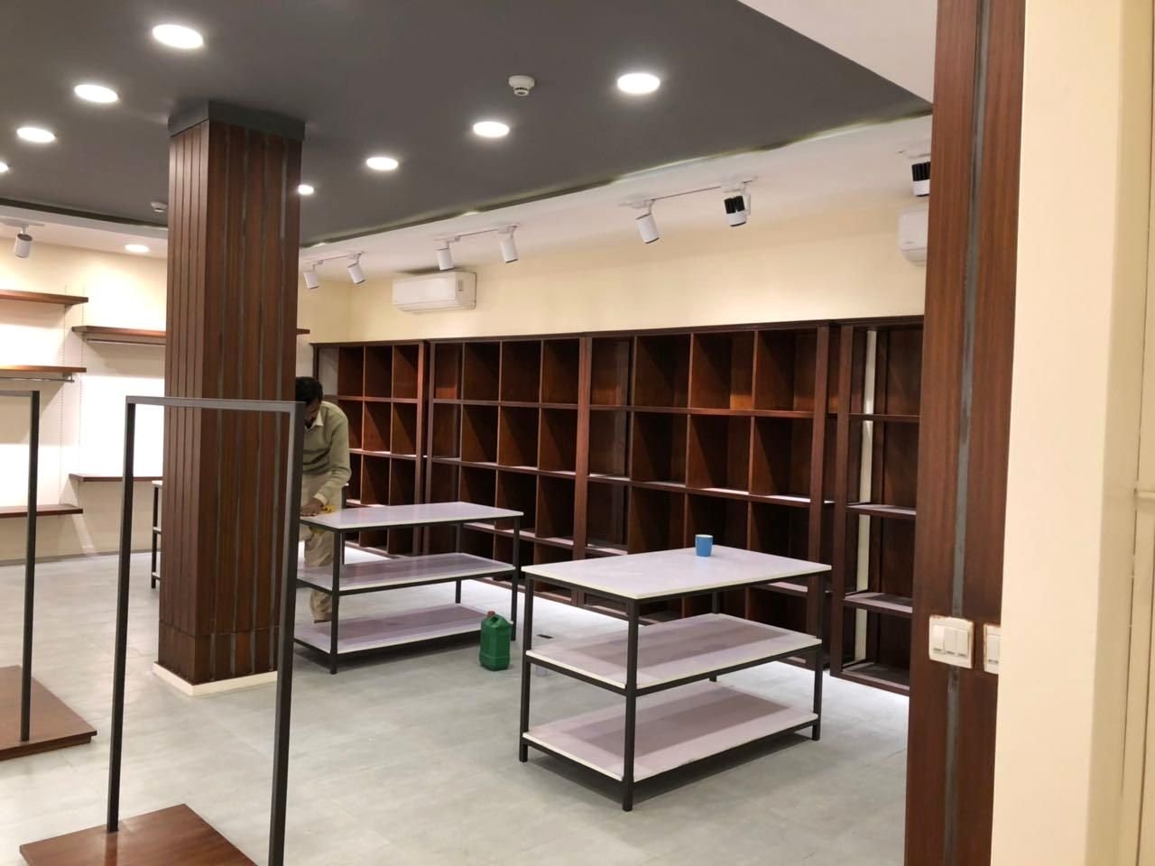 Fashion retail store fit-out with wooden shelving
